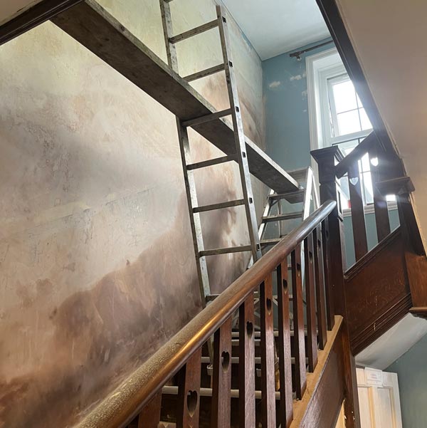 Plastering wall and staircase