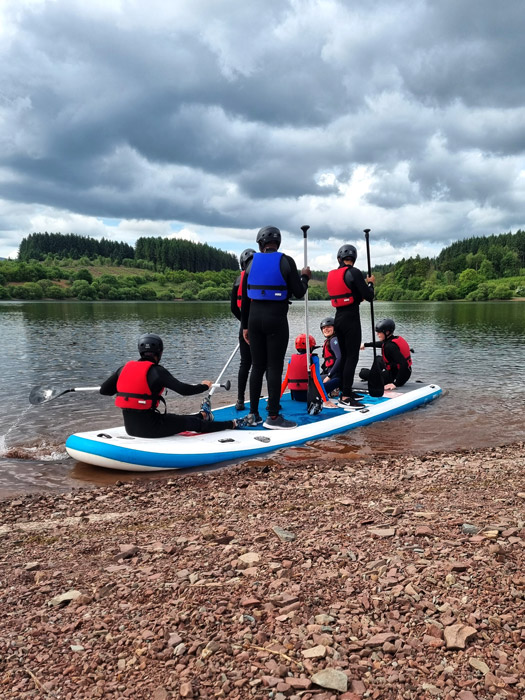 stand up padle boarding on a mega SUP