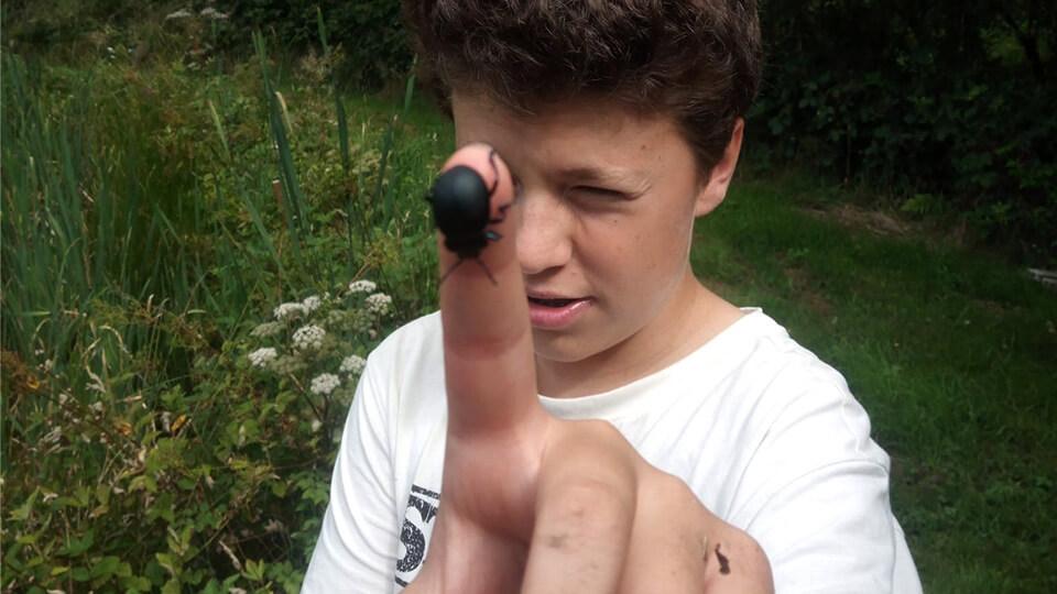 boy with beetle on his finger